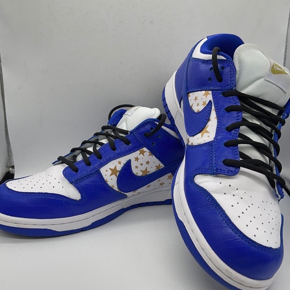 The Nike SB Dunk Low Supreme Hyper Royal, men’s size 11, white/blue